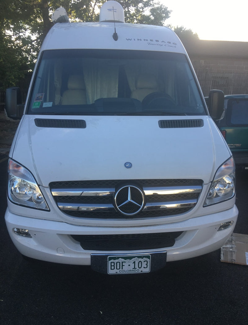 White Mercedes-Benz Sprinter Winnebago Touring Coach RV rental, front view, Colorado plates. — photo 3