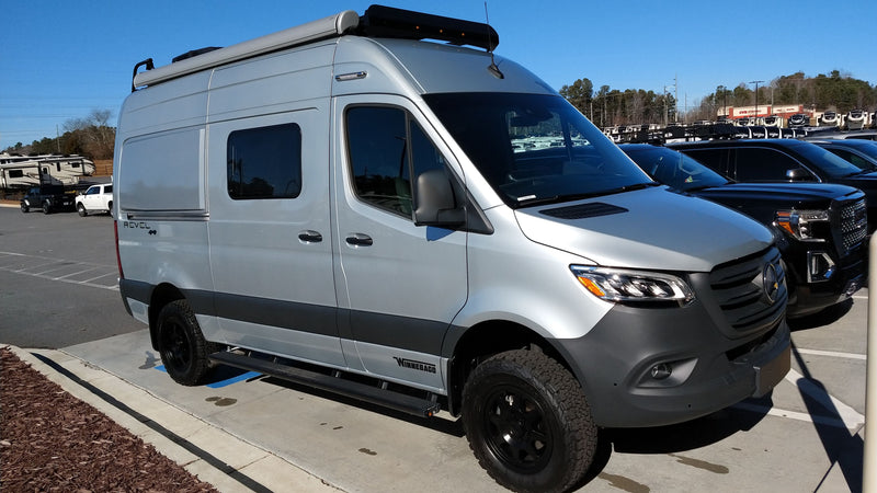 Silver Winnebago Revel camper van, ideal for RV rental adventures, parked outdoors on a sunny day. — photo 3