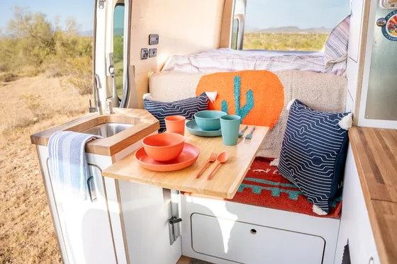  ready for adventure in the desert landscape.|Cozy RV rental interior featuring a comfy bed — photo 2