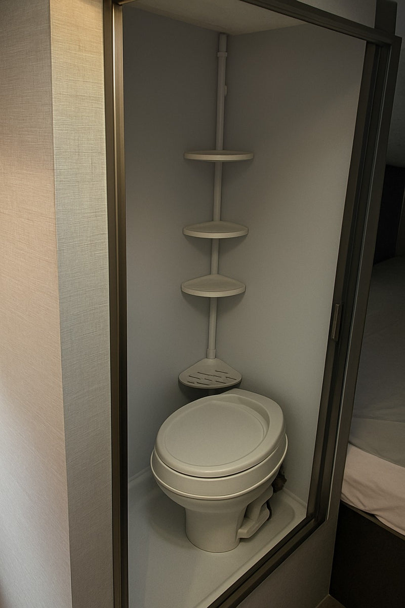 Compact RV rental wet bath featuring a toilet and space-saving corner storage shelves, optimized for small interiors. — photo 16
