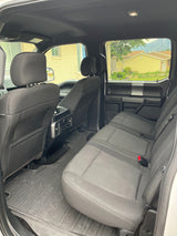 Spacious truck interior with comfortable seats & durable floor mats. Perfect for travel, complementing your RV rental search.
