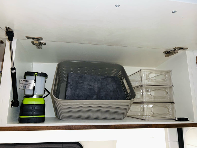  and smart storage for mobile living.|Cozy RV rental interior: bed with patterned duvet — photo 14