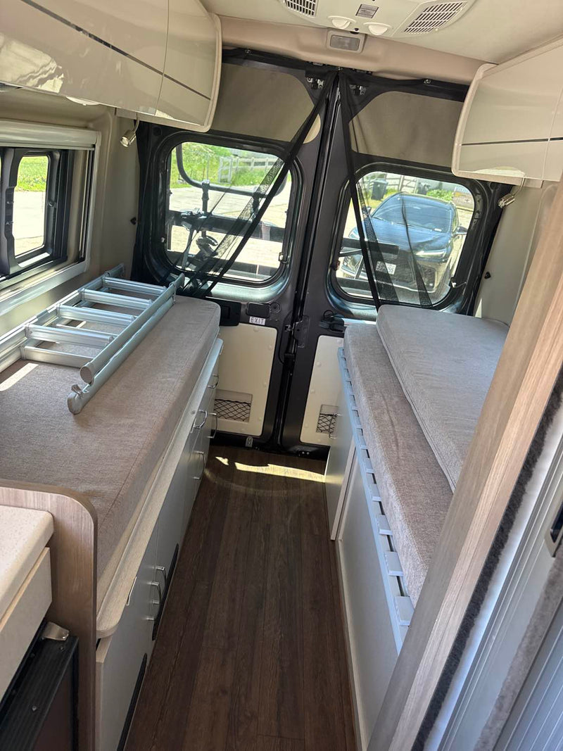  perfect for travel.|Step inside this RV rental! Features a compact kitchen with a stainless steel sink — photo 2