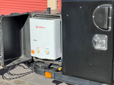 A Camplux portable water heater is visible inside an open compartment, indicating outdoor shower capability for this RV rental.