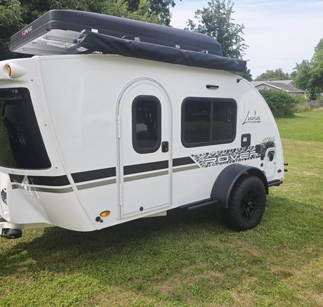White Luna Rover teardrop camper, a perfect RV rental for memorable camping and travel.