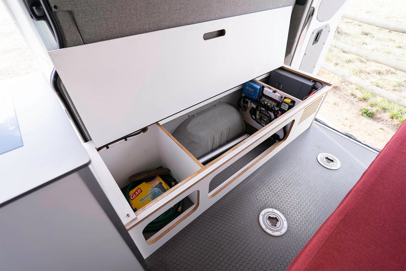  revealing smart storage. Wood ceiling & outdoor view visible.|Interior of an RV rental with wooden ceiling — photo 18
