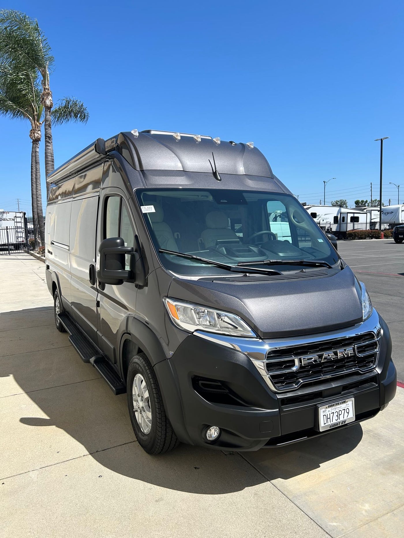  functional interior.|Dark gray Ram ProMaster van ready for your next rv rental. Parked curbside — photo 3