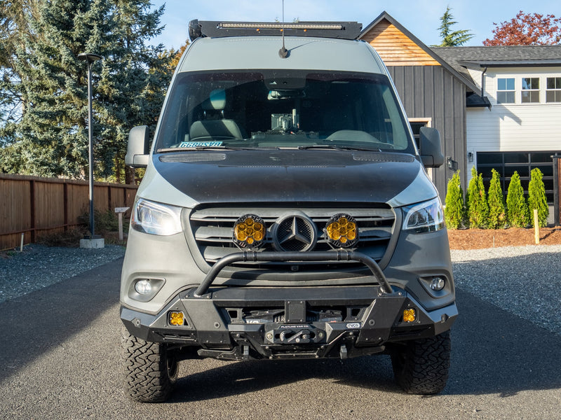  available for rv rental.|Adventure-ready gray Tiffin GH1 Sprinter van RV rental with rugged tires and roof rack.|Adventure-ready gray rv rental camper van with extended awning & rear gear rack. Perfect for off-grid travel.|Tiffin adventure-ready grey Sprinter camper van with off-road features — photo 12