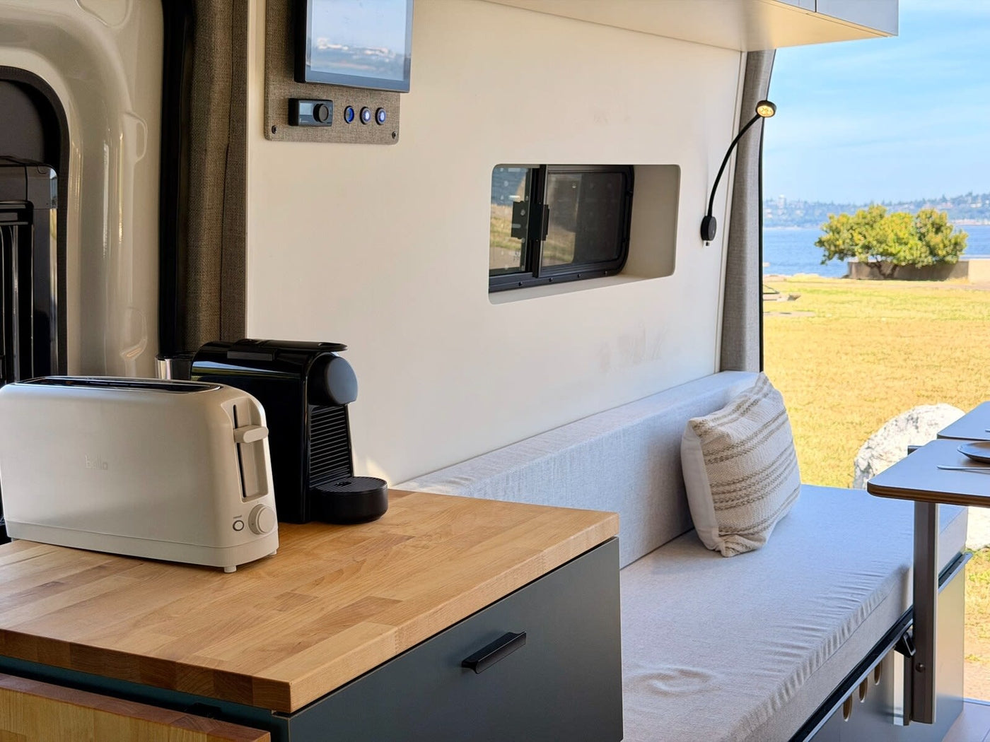  and a bed for your next road trip adventure.|Bright & modern rv rental camper van interior — photo 8
