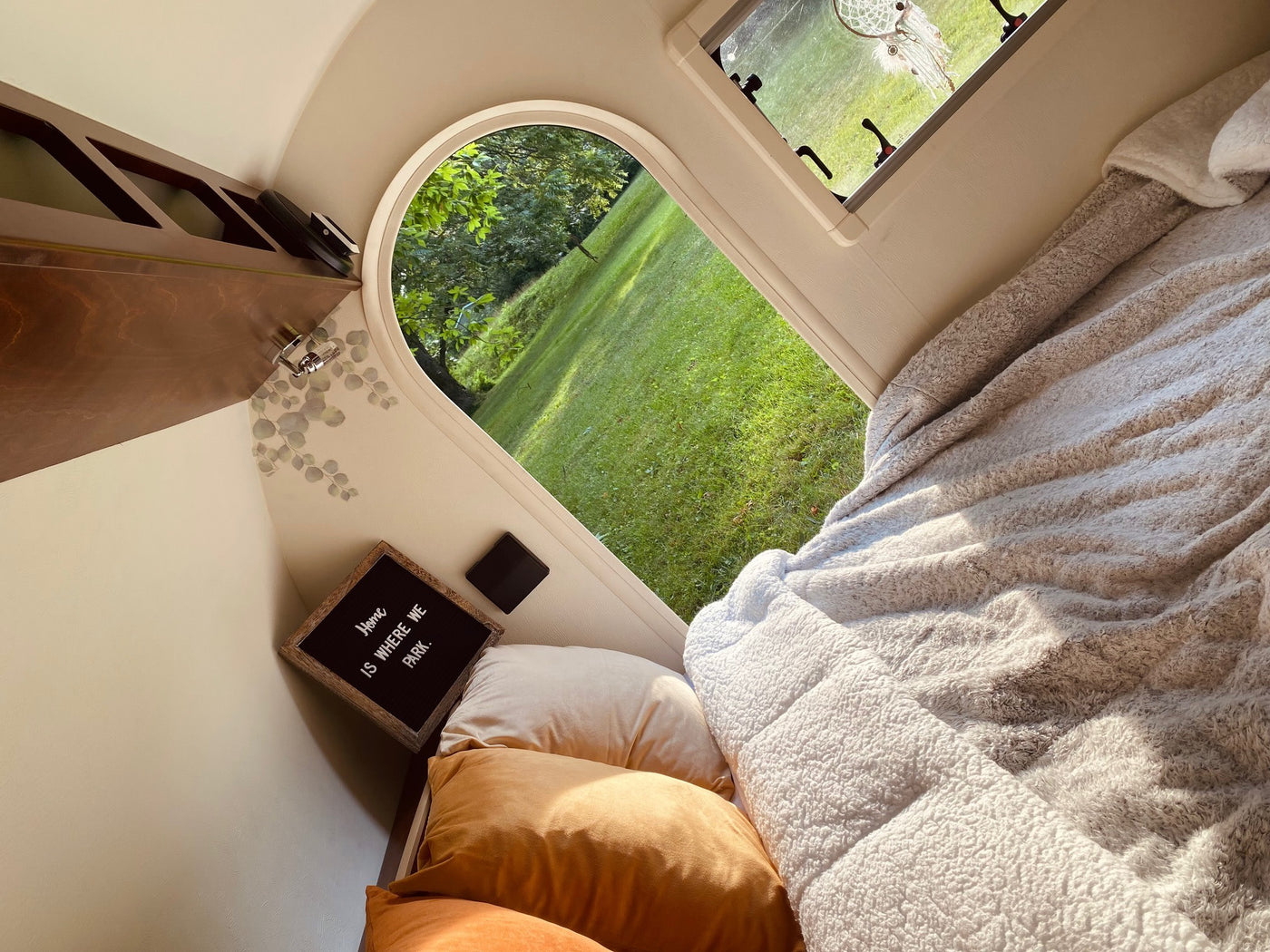  inviting outdoor adventures.|RV rental: Cozy overhead view of a bedroom with built-in wood