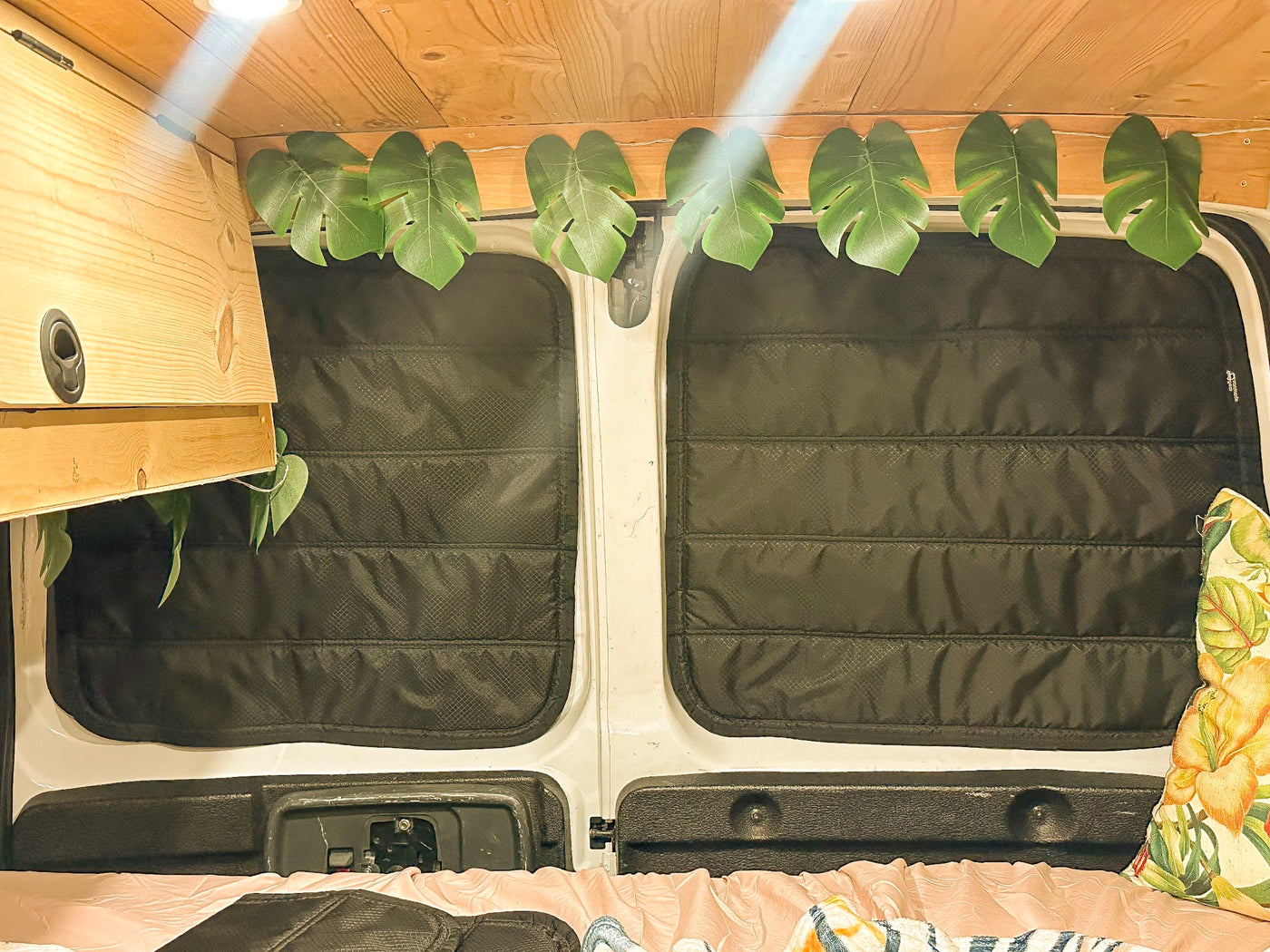  and tropical decor with string lights & surfboards.|Cozy RV rental interior at dusk: floral steering wheel — photo 11