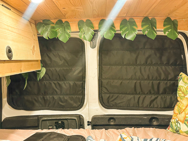  and tropical decor with string lights & surfboards.|Cozy RV rental interior at dusk: floral steering wheel — photo 11
