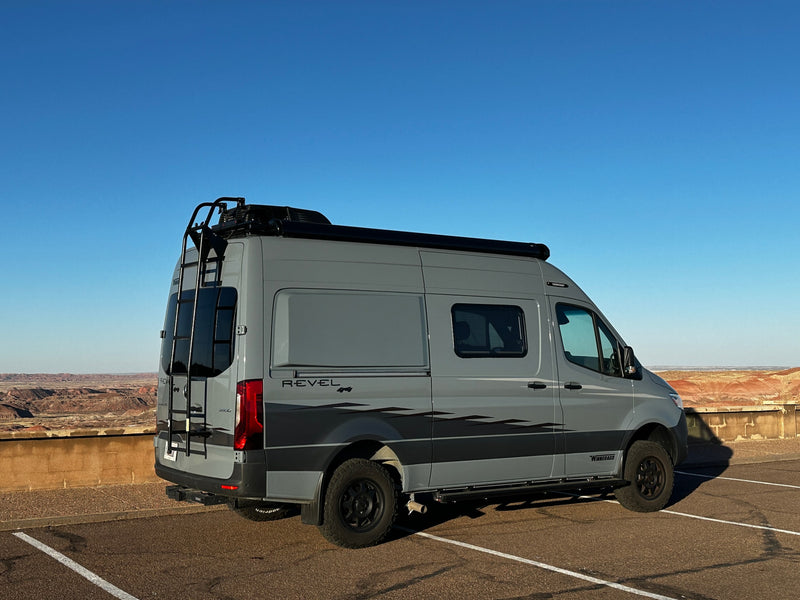 Exploring with an RV rental: a gray Winnebago Revel camper van parked at a scenic desert overlook. — photo 5