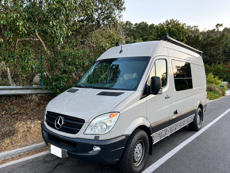  and ample storage for comfortable travel.|Inside a modern rv rental camper van. Features a comfy bed — photo 4