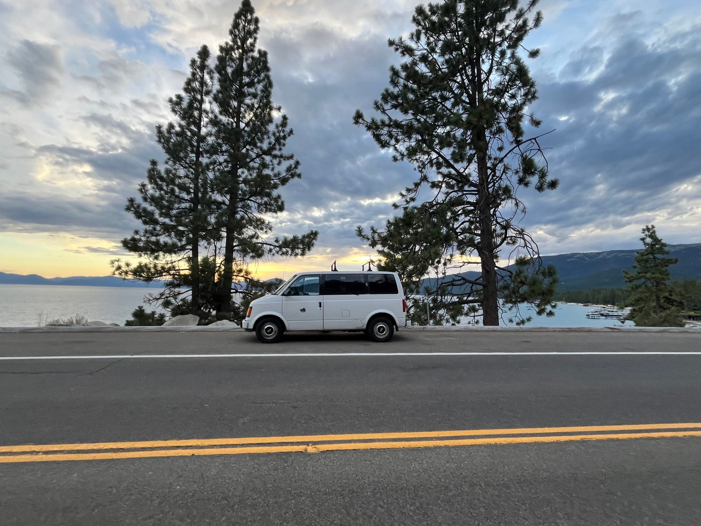  cloudy sky.|White RV rental parked roadside — photo 3