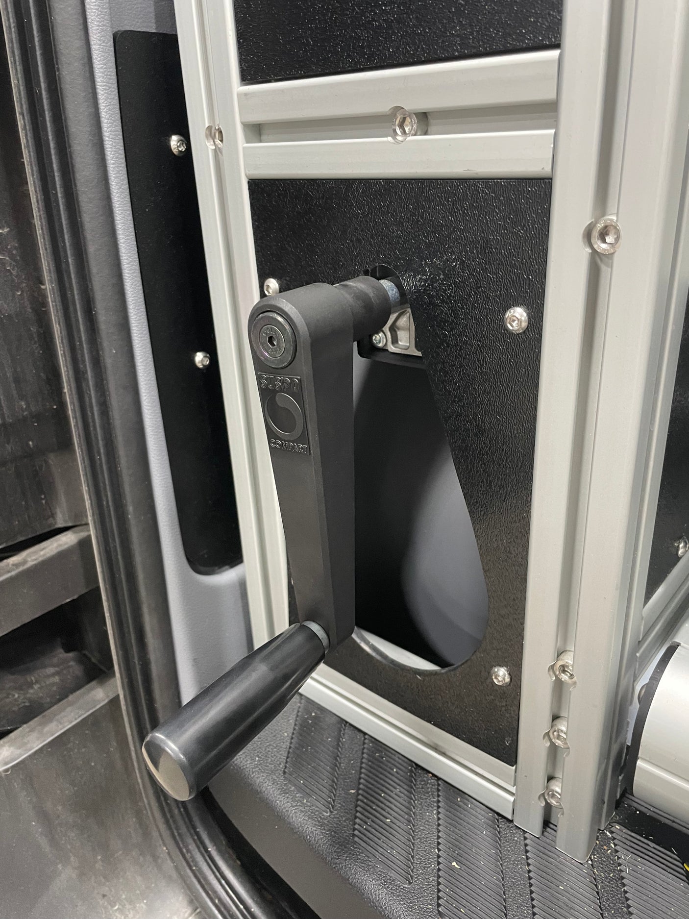 RV rental interior: Suspa Compart crank handle, part of an adjustable system built with aluminum framing.