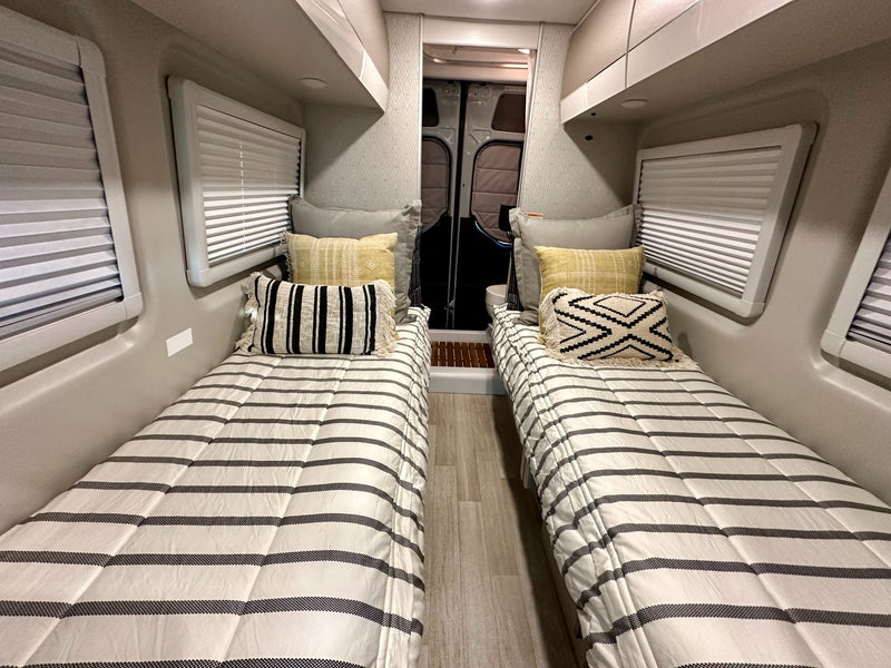  and open road ahead.|Comfortable RV rental interior with two cozy twin beds — photo 5