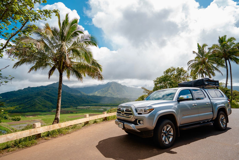 Experience a Hawaiian adventure with this RV rental! Silver Tacoma with rooftop tent overlooks lush mountains & taro fields. — photo 3