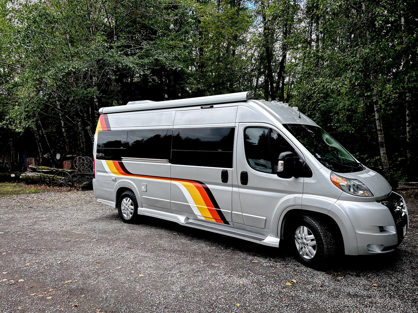  with power outlets and plush seating.|Inside this modern **rv rental**: a compact kitchen with sink/stove — photo 4