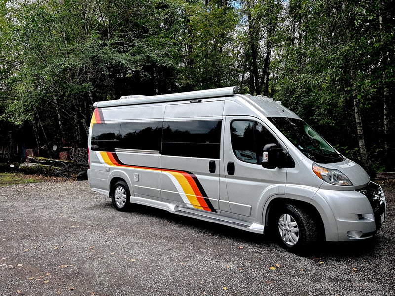  with power outlets and plush seating.|Inside this modern **rv rental**: a compact kitchen with sink/stove — photo 4