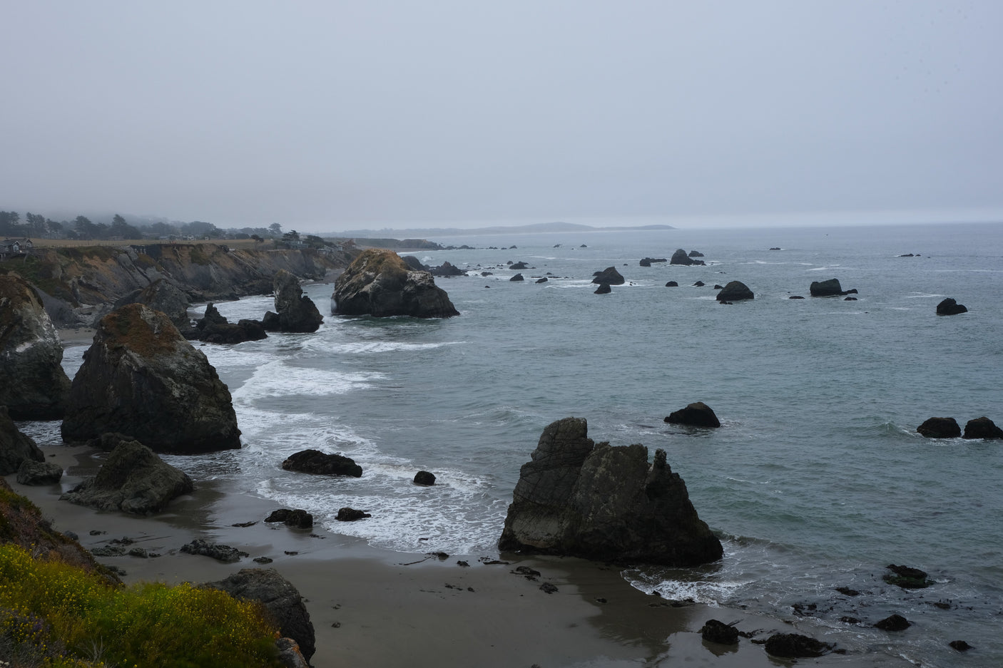 Rugged, misty Pacific coast with dramatic sea stacks & cliffs. Imagine an RV rental road trip along this scenic ocean vista.