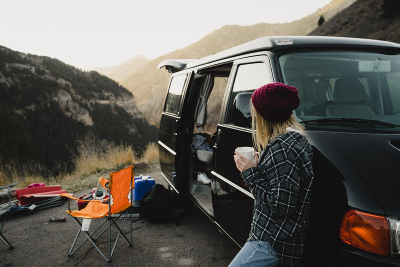  light-colored captain's chairs. Ideal for passenger comfort.|RV rental interior: rear seats fold flat — photo 6
