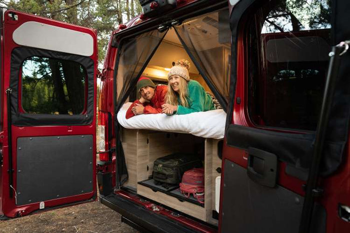  and grey floor.|RV rental interior showcases a compact kitchen with sink and stovetop