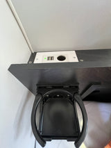 Stay charged! An **rv rental**'s overhead console features USB ports (one with a green light), a 12V outlet, and a folding cup holder.