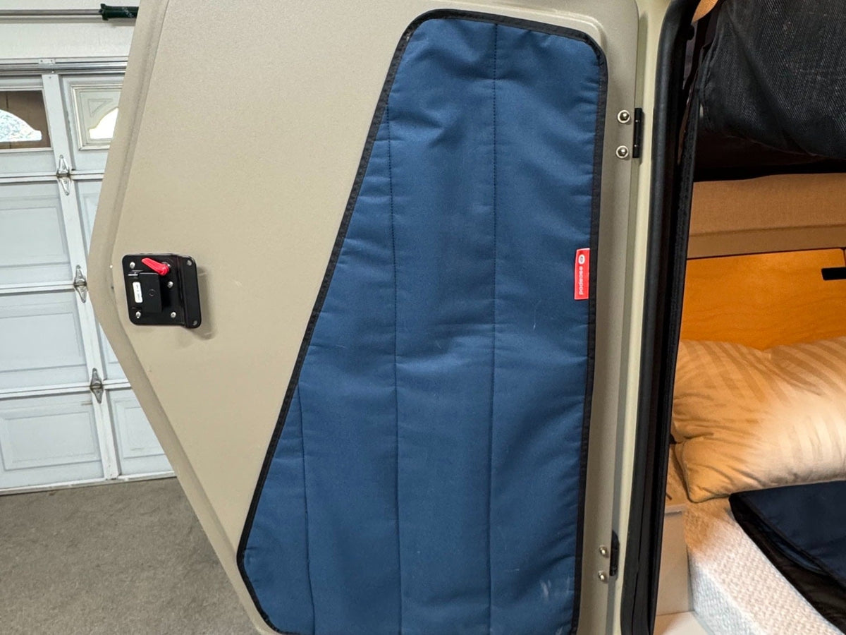  and built-in side tables.|Compact galley kitchen in an RV rental teardrop trailer — photo 9