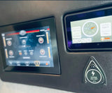 RV rental's digital power management & light control panel shows battery status, temp, and system controls.