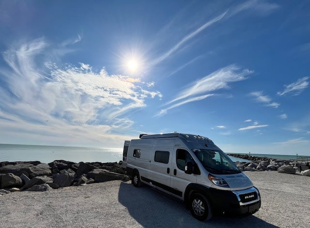  ready for adventure by the water.|Enjoy an RV rental with an outdoor shower setup