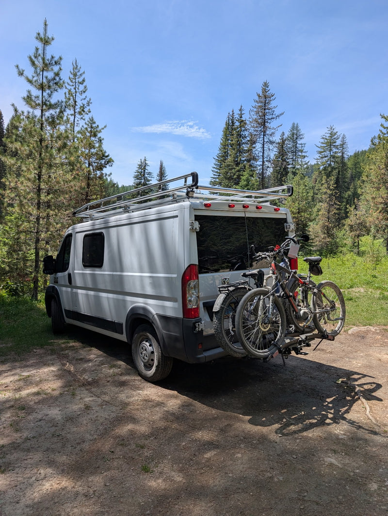  and a cozy bed with mountain window art. Explore in style!|RV rental: Interior view showing light wood-look flooring — photo 13