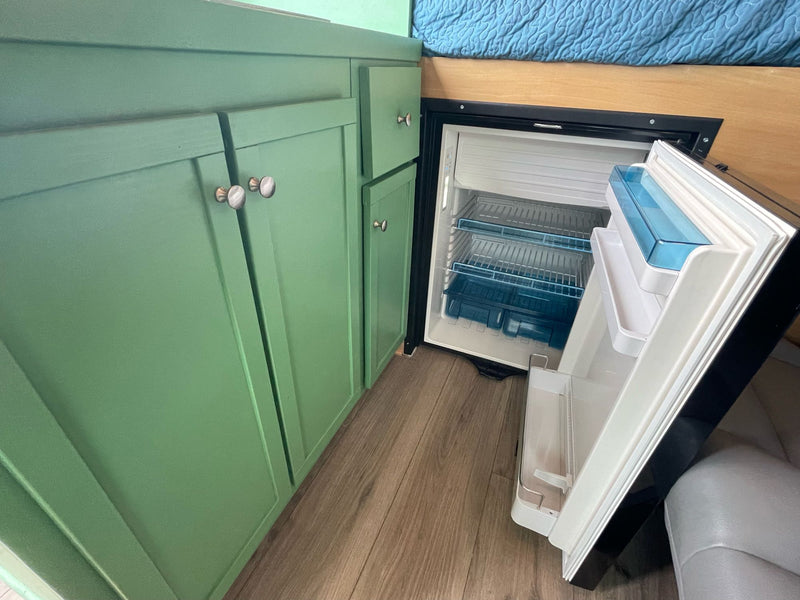  and a bowl of colorful cooking utensils.|Enjoy coffee with an ocean view from this RV rental. A French press — photo 6