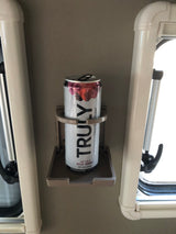 Enjoying a refreshing Truly Hard Seltzer in a convenient cup holder inside an RV rental. Perfect for travel!