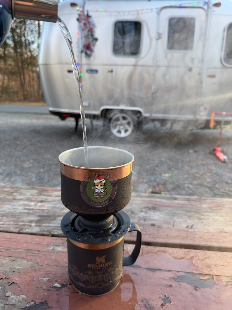  assisting with trailer hitching in an RV.|Fully equipped RV rental kitchenette: sink — photo 11