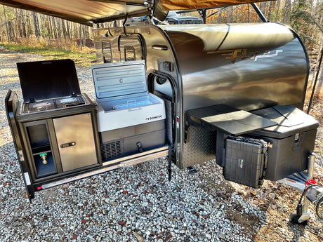 Compact Flyer RV rental with an amazing pull-out outdoor kitchen, Dometic cooler, and gear storage for overland camping.