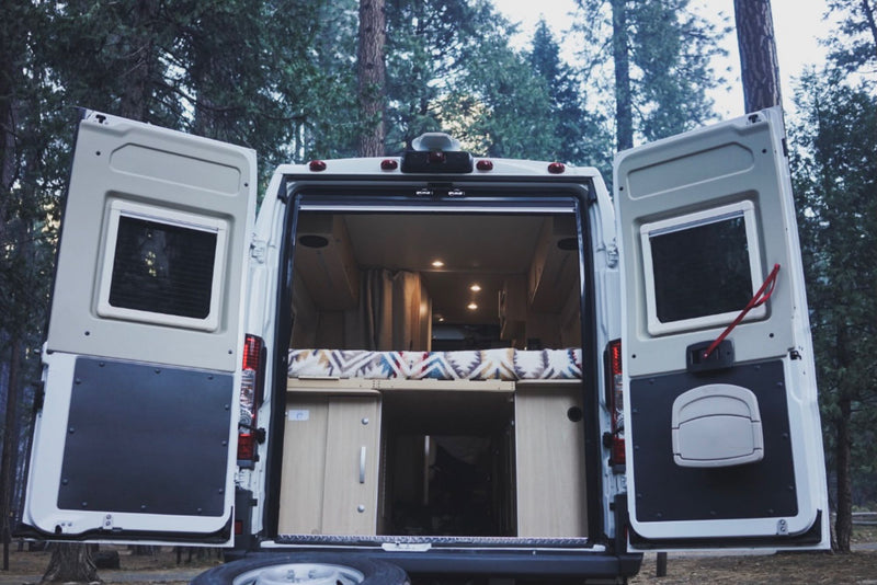  parked by a sunny beach with ocean views. Perfect for coastal travel and adventure.|White rv rental van at Yosemite — photo 6