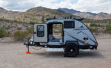 Experience desert adventures with this compact FreeSolo teardrop RV rental, perfect for rugged landscapes and starry nights.