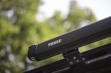 Black Thule awning case with logo, ready for your RV rental. Enhances camping & outdoor comfort.