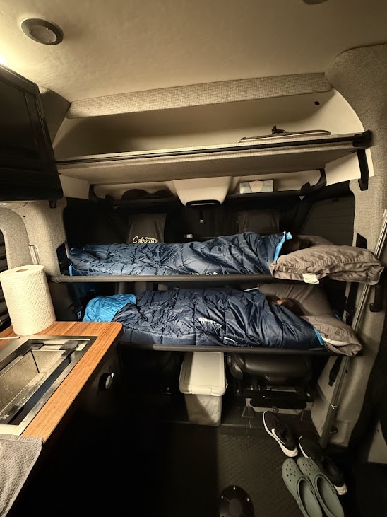  a compact camper van features a pull-out fridge — photo 12