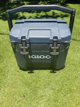 Dark grey Igloo cooler on artificial grass. Perfect for RV rental trips & outdoor adventures, keeping drinks cold on the go.