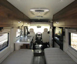 Spacious RV rental interior with kitchen, beds, and front cockpit. Ideal for road trips, comfy travel.