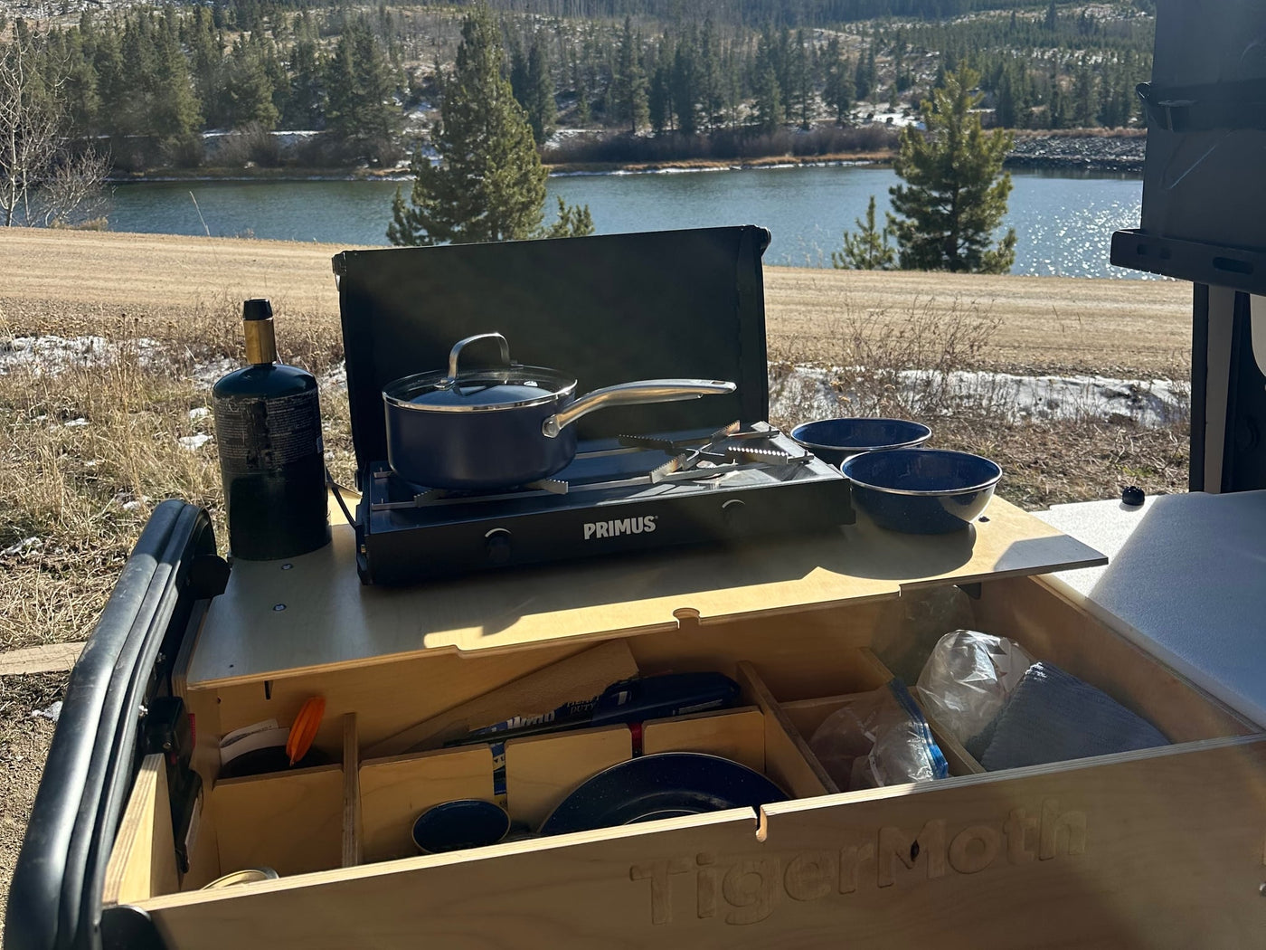  is ready for wilderness adventures at sunset.|Cozy rv rental view from bed: tranquil mountains — photo 3