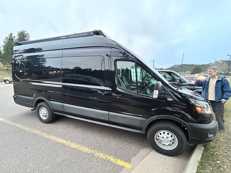  and ample storage for your journey.|Custom van interior for RV rental. Shows rear and front seating — photo 14