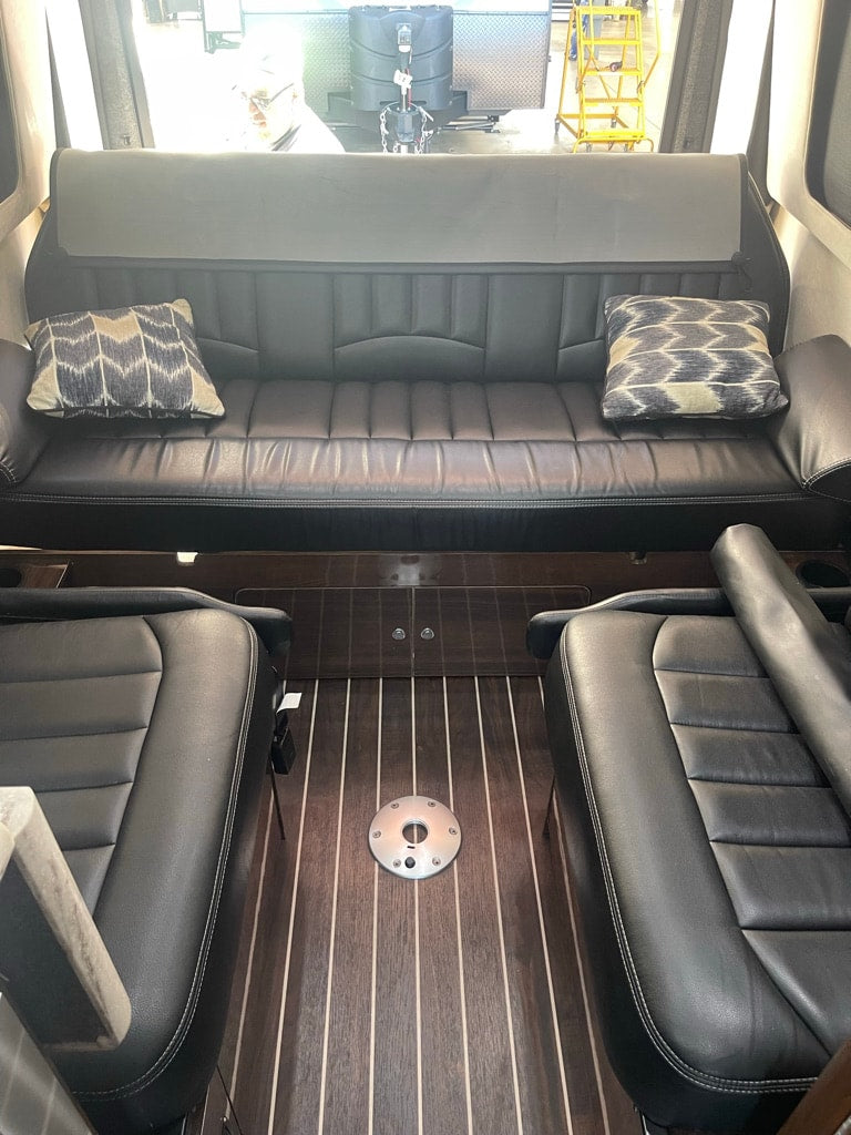  parked outdoors among other recreational vehicles.|Step inside this cozy rv rental — photo 5