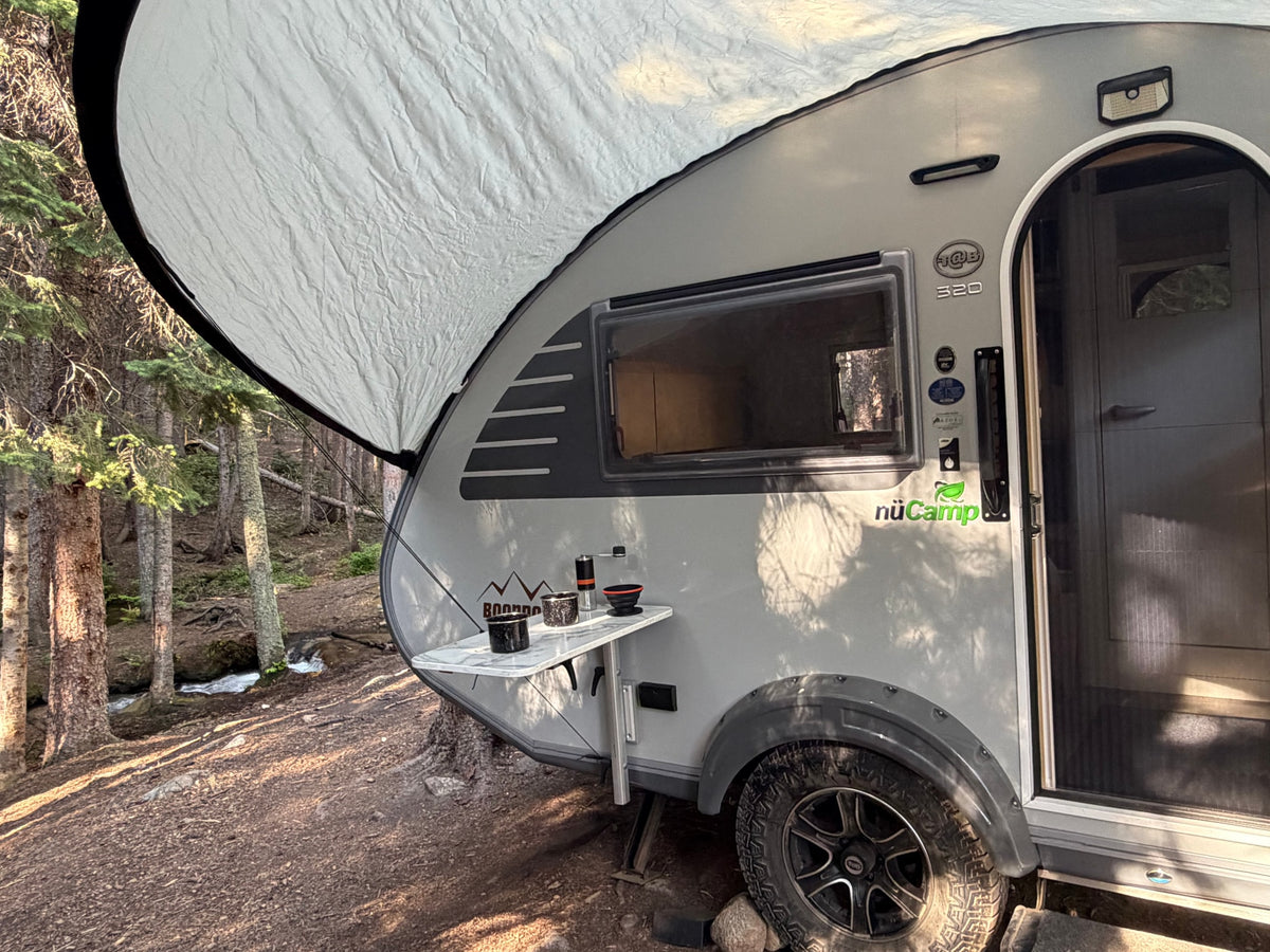  ideal for mobile living.|Inside an RV rental: a modern dinette with an iPad for work — photo 10