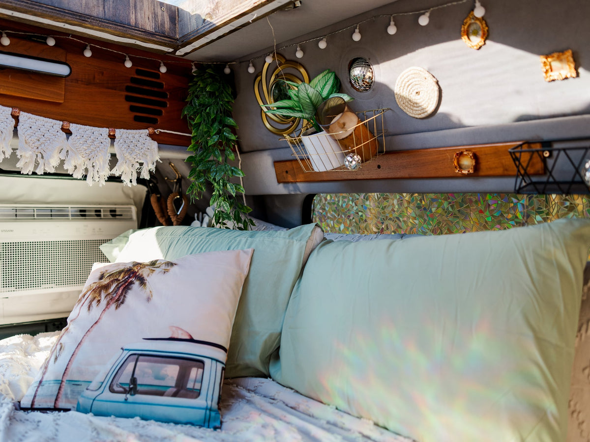  and a skylight for travel adventures.|Inside a custom RV rental: bright floral seats — photo 7