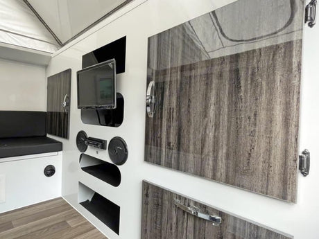  and cozy seating area.|Inside this pop-top RV rental: a cozy dining area with table