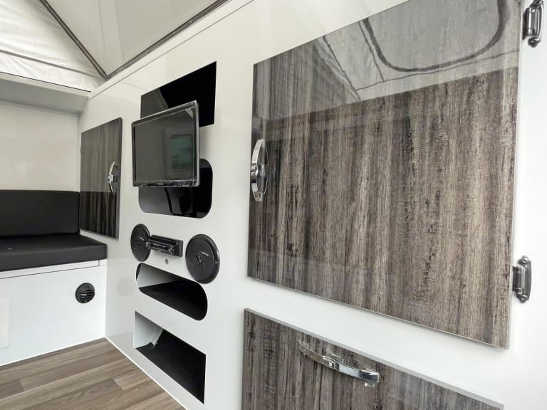  and cozy seating area.|Inside this pop-top RV rental: a cozy dining area with table — photo 7