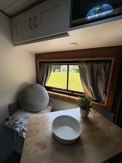  offering a scenic view for your next travel adventure.|Cooking in your RV rental! Compact kitchen counter with an induction cooktop — photo 7